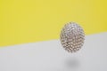 Festive easter flying egg on modern gray and yellow background Royalty Free Stock Photo