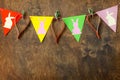 Festive Easter garland handmade with decoration of colorful rabbits and carrot