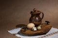 Festive Easter still life with eggs and earthenware jug. Blank for cards Royalty Free Stock Photo