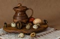 Festive Easter still life with eggs and earthenware jug. Blank for postcards Royalty Free Stock Photo