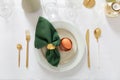 Festive Easter table setting with painted egg and burning candle, flat lay Royalty Free Stock Photo