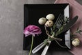 Festive Easter table setting with quail eggs and floral decoration on background, flat lay Royalty Free Stock Photo