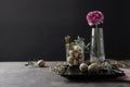 Festive Easter table setting with quail eggs and floral decoration on background. Space for text Royalty Free Stock Photo