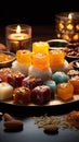 Festive ensemble Group of Indian mithai sweets adorned with a decorative diya Royalty Free Stock Photo