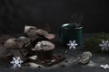 A festive evening with a warm drink and a chocolate muffin. green fir branches and snowflakes. Christmas time. Selective focus.