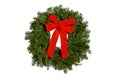 Festive evergreen Christmas wreath with red bow isolated on white background Royalty Free Stock Photo
