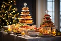 The festive feast set on the table amidst the backdrop of the beautifully adorned Christmas tree Royalty Free Stock Photo