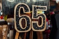 Festive figures are 65 for the birthday. Cardboard, handmade. Royalty Free Stock Photo