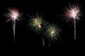 Festive fireworks colorful display isolated in bursting shapes on black background. Royalty Free Stock Photo