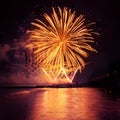 Holiday fireworks of golden color on a black sky background