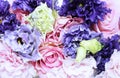 Festive floral arrangement in pastel colors. Purple and pink flowers. Irises, roses and carnations in a chic bouquet. Background f Royalty Free Stock Photo