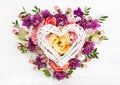 Festive floral composition with heart from wooden branches Royalty Free Stock Photo