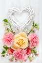 Festive floral composition with heart from wooden branches Royalty Free Stock Photo