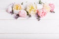 Festive flower composition on the white wooden background. Overhead view Royalty Free Stock Photo