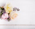 Festive flower composition on the white wooden background. Overhead view Royalty Free Stock Photo