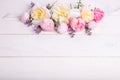 Festive flower composition on the white wooden background. Overhead view Royalty Free Stock Photo