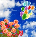 festive flowers and bright multi-colored inflatable balls against the background of the sky with clouds