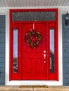 Festive front door on a snowy day in Daybreak Utah