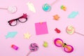 Festive funny celebration background with paper fish, sticky note and decor on pink background. All Fools ' Day, humor, prank, jok Royalty Free Stock Photo