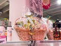 Festive gift basket with assorted gourmet items in supermarket display Royalty Free Stock Photo