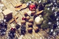 Festive Gift with Box, Cinnamon Sticks, Dried Oranges, Baubles, Cones, Walnuts. Royalty Free Stock Photo