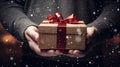 Festive Gift Box with Glitter and Bow in Man's Hands. Generative ai Royalty Free Stock Photo