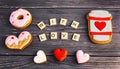 Festive gift gingerbread for Valentine\'s Day in the shape of a cup of coffee, hearts and a donut