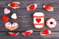 Festive gift gingerbread for Valentine\'s Day in the shape of a cup of coffee, hearts and a donut