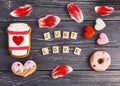 Festive gift gingerbread for Valentine\'s Day in the shape of a cup of coffee, hearts and a donut