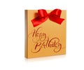 Festive gold box with a red bow on white background and text Happy Birthday. Calligraphy lettering Royalty Free Stock Photo
