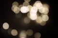 Festive golden blurred lights. Shiny bokeh. Abstract defocused lights. Glowing effect concept. Royalty Free Stock Photo