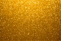 Festive golden bokeh background with sparkling glitter Royalty Free Stock Photo