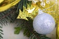 Festive golden christmas decoration, candles, white balls, green fir tree branch Royalty Free Stock Photo