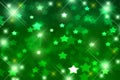 Festive green bokeh background, blurred, glitter, disco, Christmas, green stars, birthday, fun Royalty Free Stock Photo