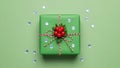 Festive green gift box with red bow and sequins isolated on white background Royalty Free Stock Photo