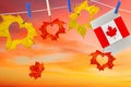 Festive greeting cards with Canadian flag and color maple leaves carved love hearts against beautiful bright sunrise sky