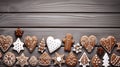 Festive greeting Christmas cookies in the shape of a heart, Christmas trees, human figures, with a white glaze pattern