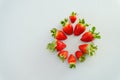 Festive grey background. Fresh ripe strawberries on a plate close up. Valentine`s Day. Food backgrounds. Creative greeting card