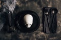 Festive Halloween table setting in a black style. Plate with fork, spoon and knife on a linen napkin. Halloween dinner. Minimal