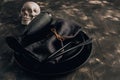 Festive Halloween table setting in a black style. Plate with fork, spoon and knife on a linen napkin. Halloween dinner. Minimal