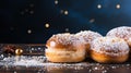 Festive Hanukkah background with Sufganiyot on dark backgrround