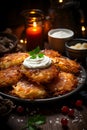 Festive Hanukkah meal - homemade latkes with sour cream