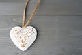 Festive heart shaped Christmas or New Year ornament with twine