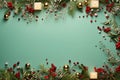 A festive holiday arrangement with red berries, pine branches, gold ornaments, and a glowing candle Royalty Free Stock Photo