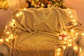 Festive Home interior - wew year or christmas decoration. At night, the room glows with festive lights. A lots of gifts and Royalty Free Stock Photo