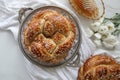 Festive Homemade baked round challah bread glazed with honey and sugar for Rosh Hashanah Jewish New Year