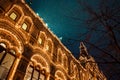 Festive illuminations in streets of city. New Year and Christmas lights decoration of at snowy night, Red Square, Moscow, Russia. Royalty Free Stock Photo