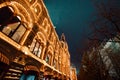 Festive illuminations in streets of city. New Year and Christmas lights decoration in snowy night, Red Square, Moscow, Russia. Royalty Free Stock Photo