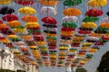 Festive installation - alley of umbrellas on the street of the city