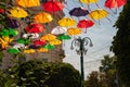 Festive installation - alley of umbrellas on the street of the city